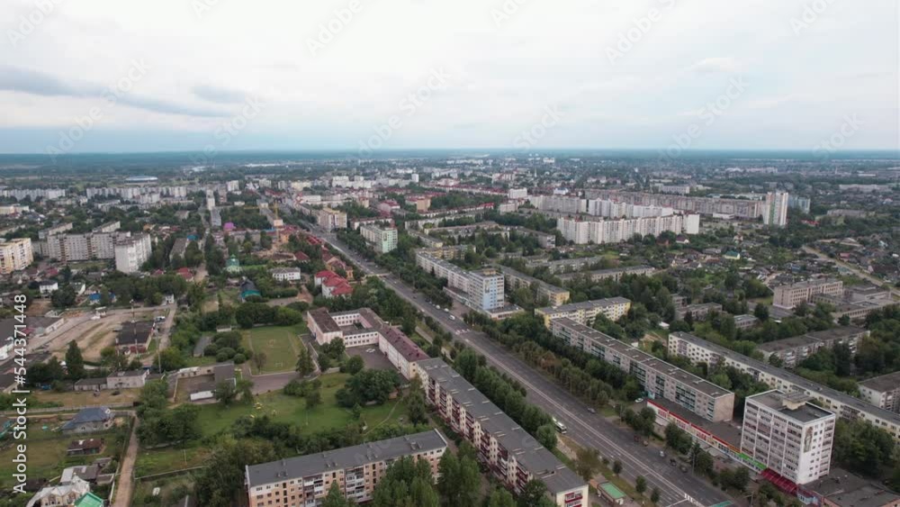 Aerial view of chapel and monument near central road of the city and microdistricts and private sector on outskirts Aerial view of chapel and monument near central road of the city and microdistricts and private sector on outskirts