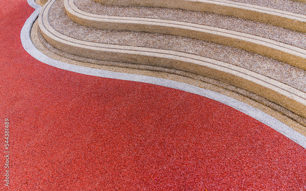 © Nature Peaceful  - Red rubber floor and curve pebble stairs well space for text