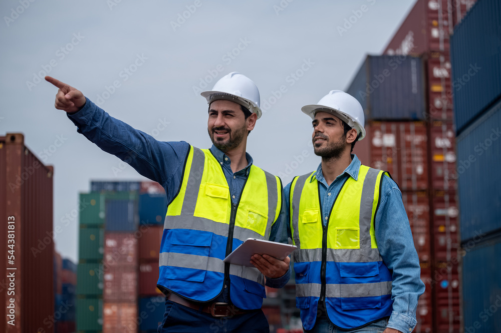 Team Businessman working on site containers yard for business shipping import and export, Caucasian worker inspecting container in warehouse logistic delivery services, export management team. Team Businessman working on site containers yard for business shipping import and export, Caucasian worker inspecting container in warehouse logistic delivery services, export management team.