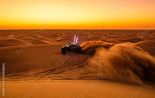 Offroad safari in sand desert, Empty Quarter Desert in United Arab Emirates. Offroad buggy in dunes of Rub’ al Khali desert after sunset. © Sergo