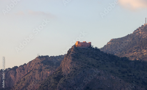 Modern Building on top of a mountain in Palermo, Sicily, Italy. Sunny Sunset.