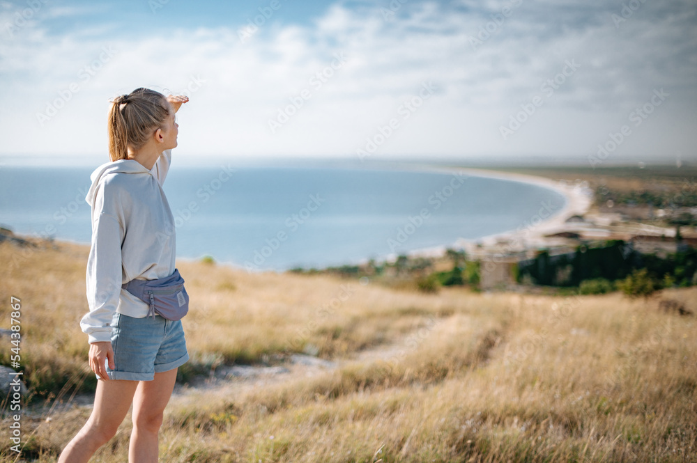 Traveller girl outdoor in park looking into the horizon Traveller girl outdoor in park looking into the horizon