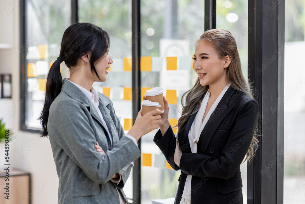 Entrepreneur Two Asian business discussing new business project in tablet in modern meeting room, business plan investment, finance analysis concept. Entrepreneur Two Asian business discussing new business project in tablet in modern meeting room, business plan investment, finance analysis concept.