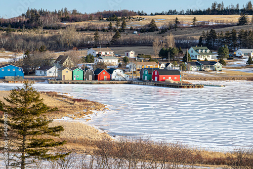 A view across a frozen river at the fishing community of French River, Prince Edward Island, Canada. photo