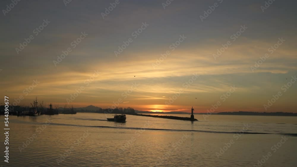 Fraser River Fishboat Departing Steveston BC 4K UHD. A boat departs Steveston Harbor on the Fraser River in British Columbia, Canada at sunrise. 4K, UHD.
Fraser River Fishboat Departing Steveston BC 4K UHD. A boat departs Steveston Harbor on the Fraser River in British Columbia, Canada at sunrise. 4K, UHD.
