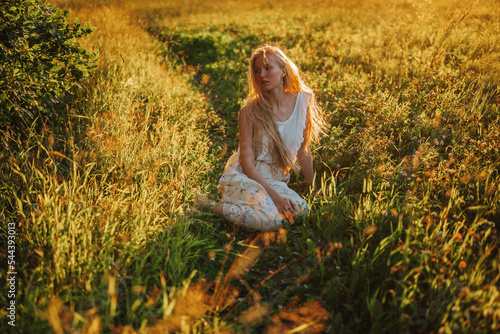 woman sitting on the grass