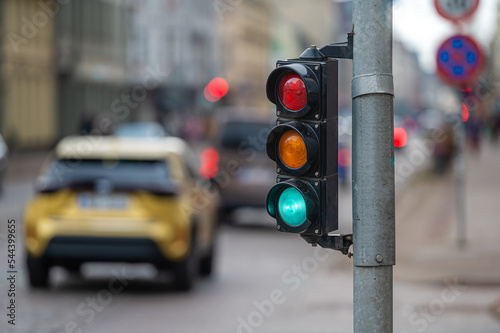 Print op canvas traffic light on the street junction with beautiful bokeh, city with cars in the