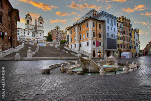 The Fontana della Barcaccia, at sunset, is a fountain found at the foot of the Spanish Steps in Rome's Piazza di Spagna (Spanish Square) created by Bernini. Rome Italy