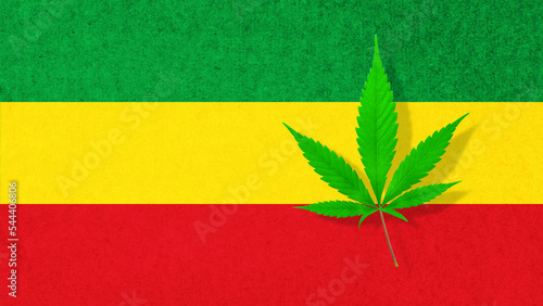 Obraz na płótnie Cannabis hemp leaf on rasta flag colors background.
