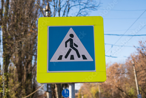Pedestrian crossing sign. Pedestrian crossing on the street. Place of transition