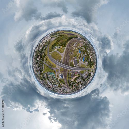 Wallpaper Mural tiny planet in sky with clouds overlooking old town, urban development, historic buildings and crossroads. Transformation of spherical 360 panorama in abstract aerial view. Torontodigital.ca