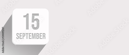 September 15th. Day 15 of month, Calendar date. Calendar leaf icon on white with sunlight and long shadow, flat design. Autumn month, day of the year concept.