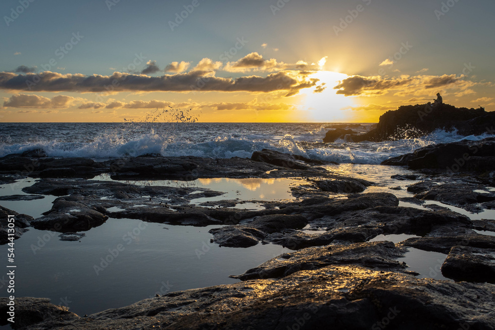 Fototapeta premium Beautiful ocean landscape of the dawn and a silhouette of a fisher man