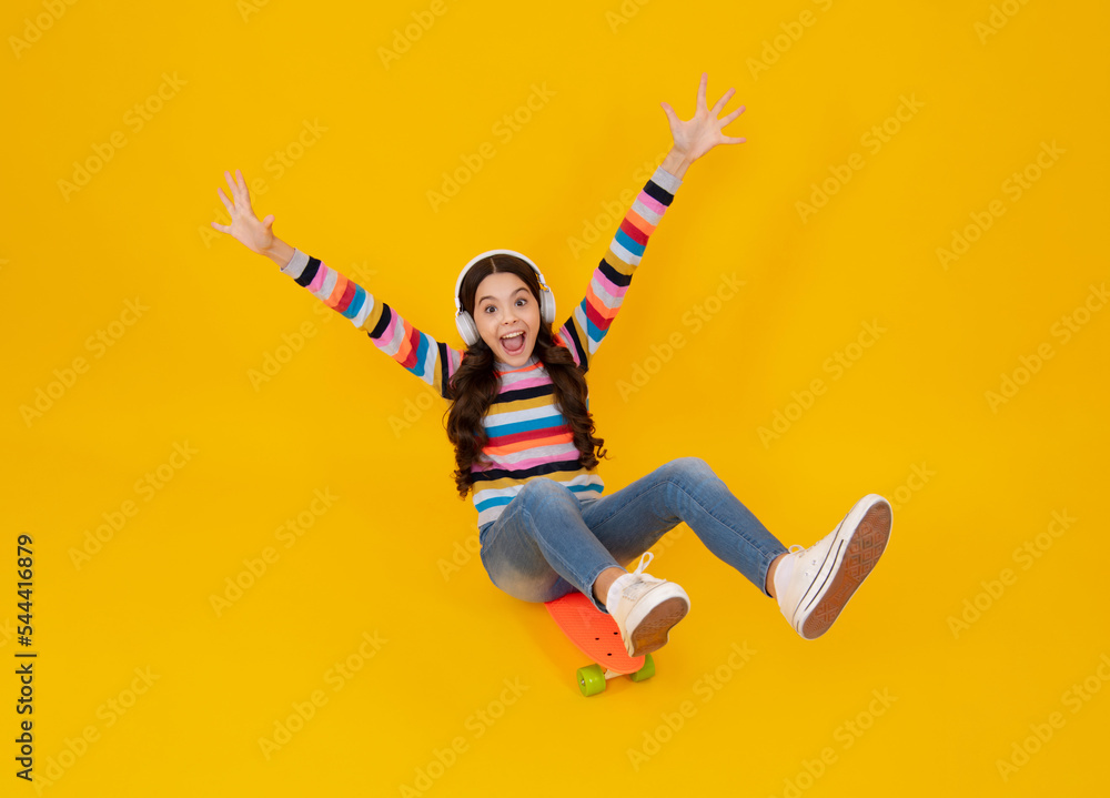 Teen school girl with skateboard on studio isolated background. Schoolgirl trend, urban teenager style. Happy teenager, positive and smiling emotions of teen girl. Teen school girl with skateboard on studio isolated background. Schoolgirl trend, urban teenager style. Happy teenager, positive and smiling emotions of teen girl.