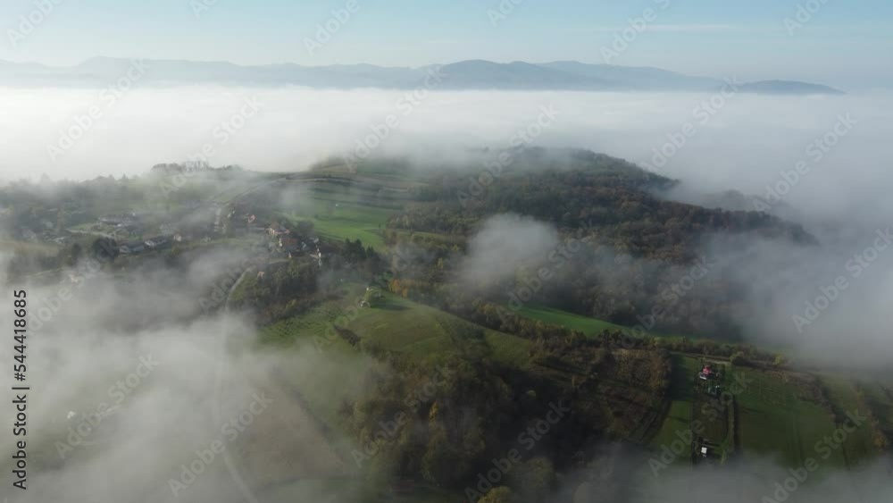 clouds in the early morning, hilly terrain, shot by drone, height about 400 meters, early autumn, central Europe clouds in the early morning, hilly terrain, shot by drone, height about 400 meters, early autumn, central Europe