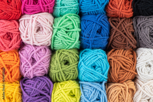 Balls of colourful yarn as background