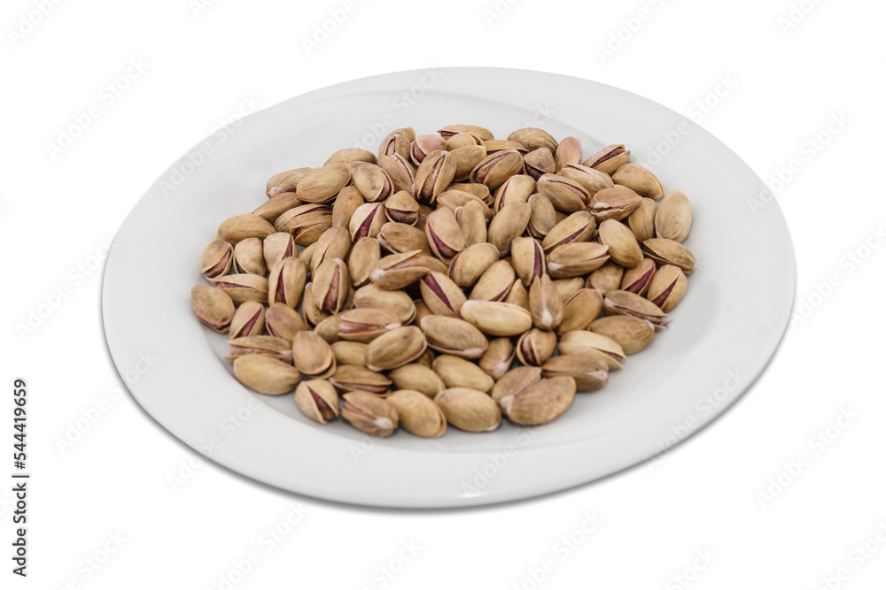 Roasted Salted Pistachios on a Porcelain Plate Roasted Salted Pistachios on a Porcelain Plate