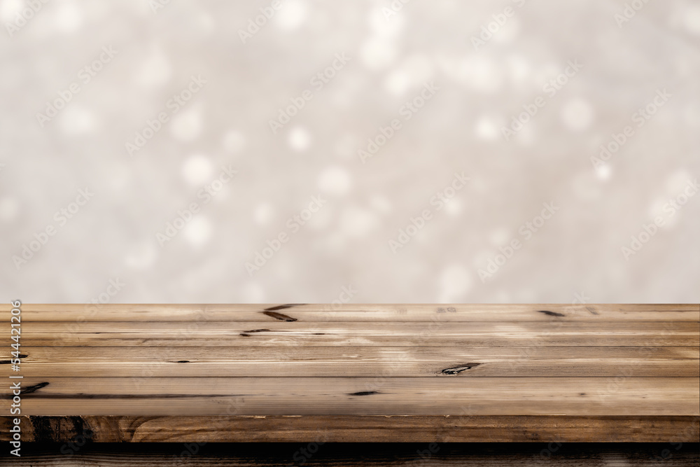 Fototapeta premium Empty wooden table for product placement or montage with focus to the table top blurred bokeh background, suitable for montage product