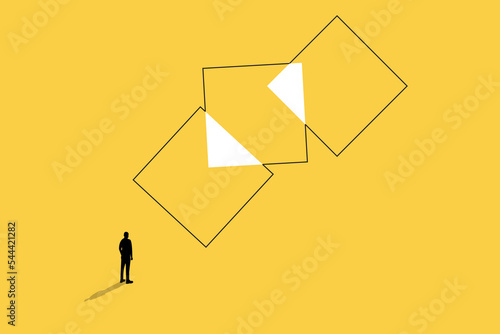 businessman looking at combination of square. concept of business merger, partnership and team work.