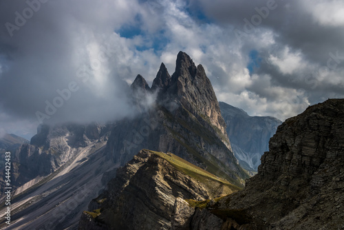 Clouds over mountain massif Odle in Dolomites