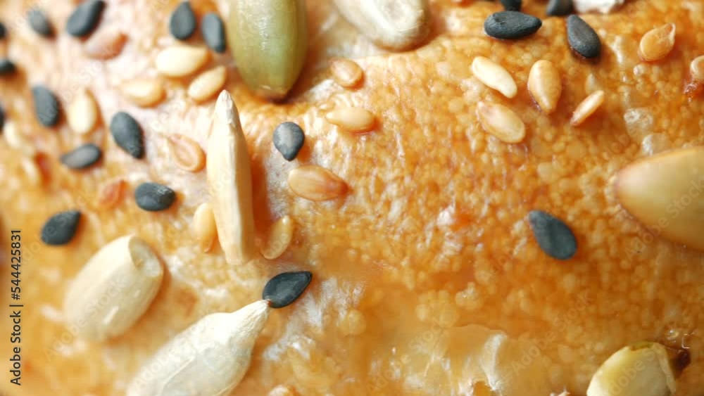 detail shot of sunflower seed baked bread on table detail shot of sunflower seed baked bread on table
