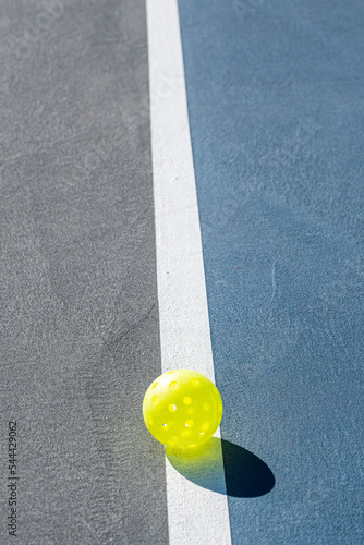 People Playing pickleball outdoors.  