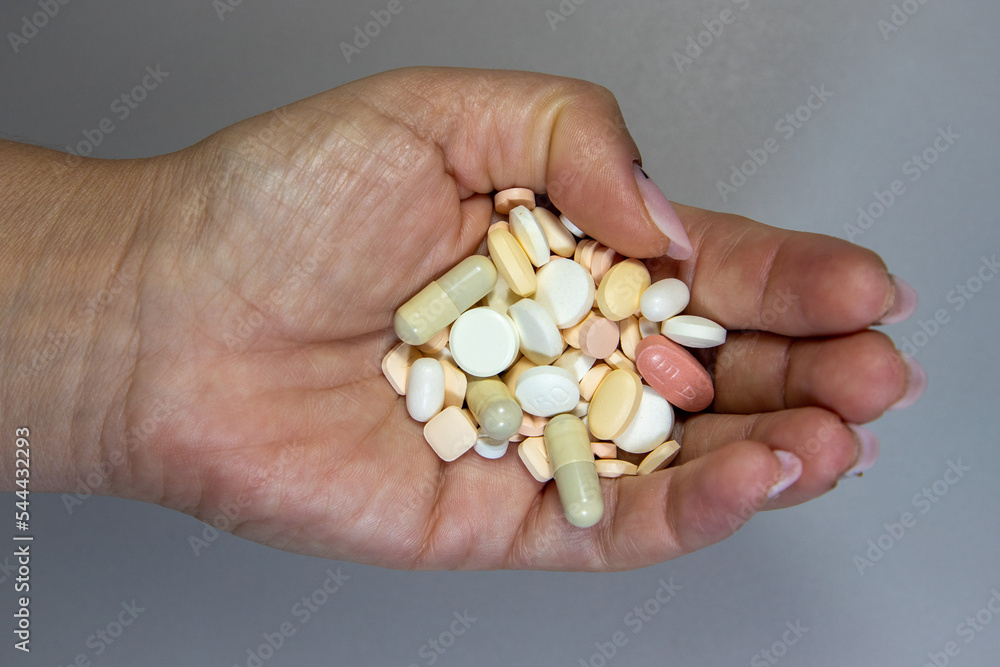 Many medicine pills in one palm Many medicine pills in one palm