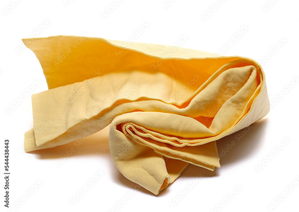 Yellow synthetic deerskin, chamois for cleaning car windows isolated on white Yellow synthetic deerskin, chamois for cleaning car windows isolated on white
