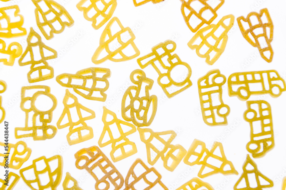 Curly vermicelli for children in the form of toys on a white background. Curly vermicelli for children in the form of toys on a white background.
