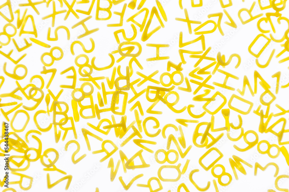 Curly vermicelli for children in the form of letters on a white background. Curly vermicelli for children in the form of letters on a white background.