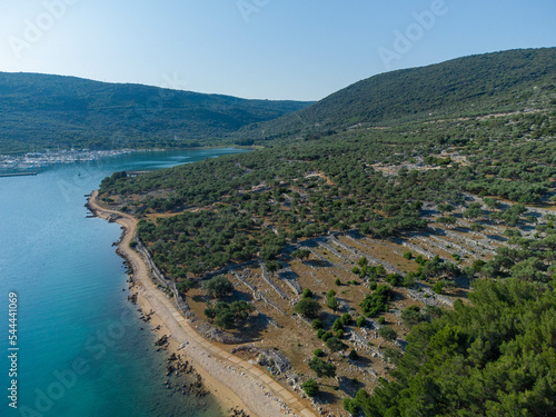 Mountainous coastline of island Cres covered with forest and pristine sea