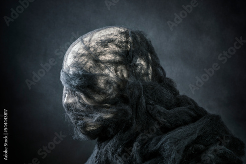 Creepy figure on dark misty background