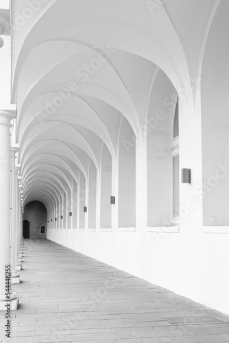 corridor with columns and arches