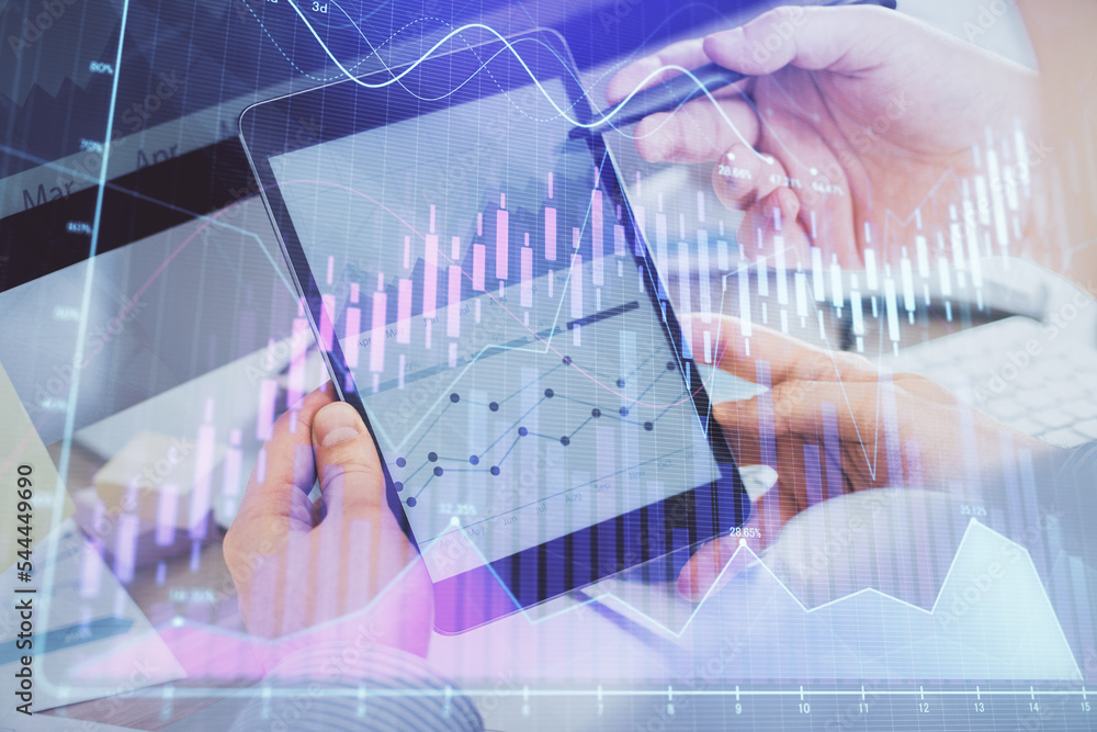 Double exposure of man's hands holding and using a phone and financial chart drawing. Market analysis concept. Double exposure of man's hands holding and using a phone and financial chart drawing. Market analysis concept.