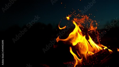 Super slow motion of campfire placed on a meadow. Filmed on high speed cinema camera. photo