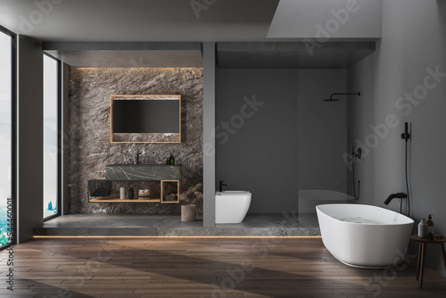 Modern minimalist bathroom interior  modern bathroom cabinet  black sink  bathroom accessories  bathtub and toilet  parquet floor. 3d rendering