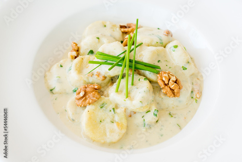Cheese gnocchi with blue cheese sauce and garlic