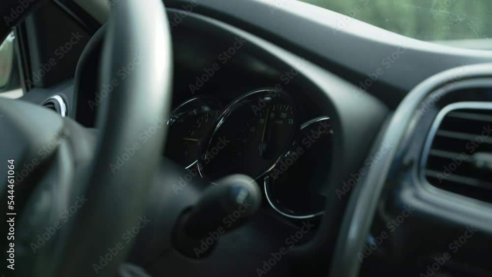 Dashboard of car in motion. Arrow on tachometer falls and rises. Dashboard of car in motion. Arrow on tachometer falls and rises.
