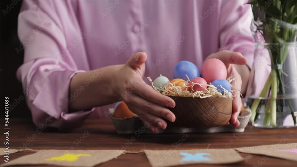 Happy Easter holiday. Coloring eggs close-up. Woman preparing for Easter, painting and decorating eggs. Christian celebration, family traditions. Happy Easter holiday. Coloring eggs close-up. Woman preparing for Easter, painting and decorating eggs. Christian celebration, family traditions.