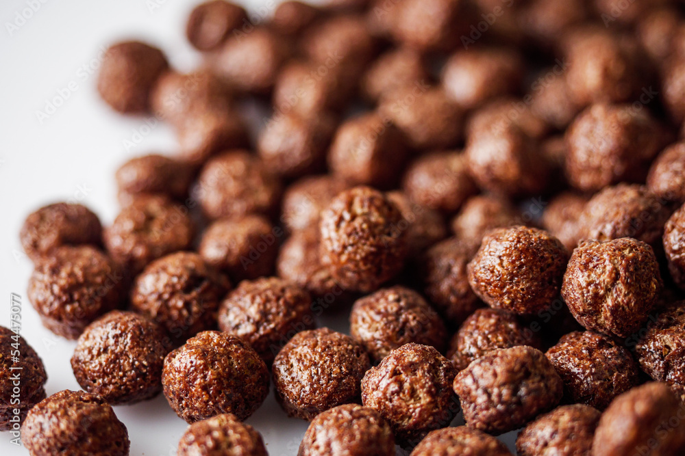sweet crunchy chocolate children's breakfast chocolate balls on a white background sweet crunchy chocolate children's breakfast chocolate balls on a white background