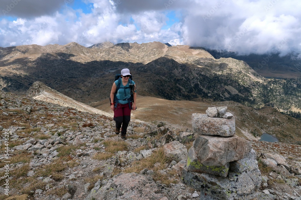 Summer Hiking on the ridges and summits around the Pyrenees (Cerdanya). Forests and pastures with rocky areas on top of the mountains.
