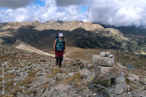 Summer Hiking on the ridges and summits around the Pyrenees (Cerdanya). Forests and pastures with rocky areas on top of the mountains. 