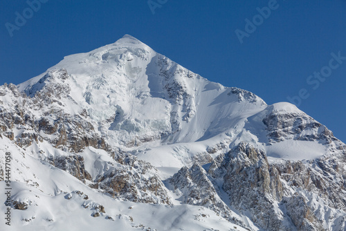 Tetnuldi mountain slope covered with snow and glaciers, Caucasus Mountains, mountaineering in Georgia