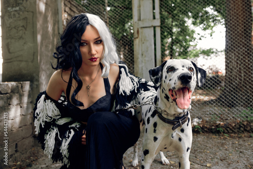 Cosplay on Cruella de Vil with a Dalmatian