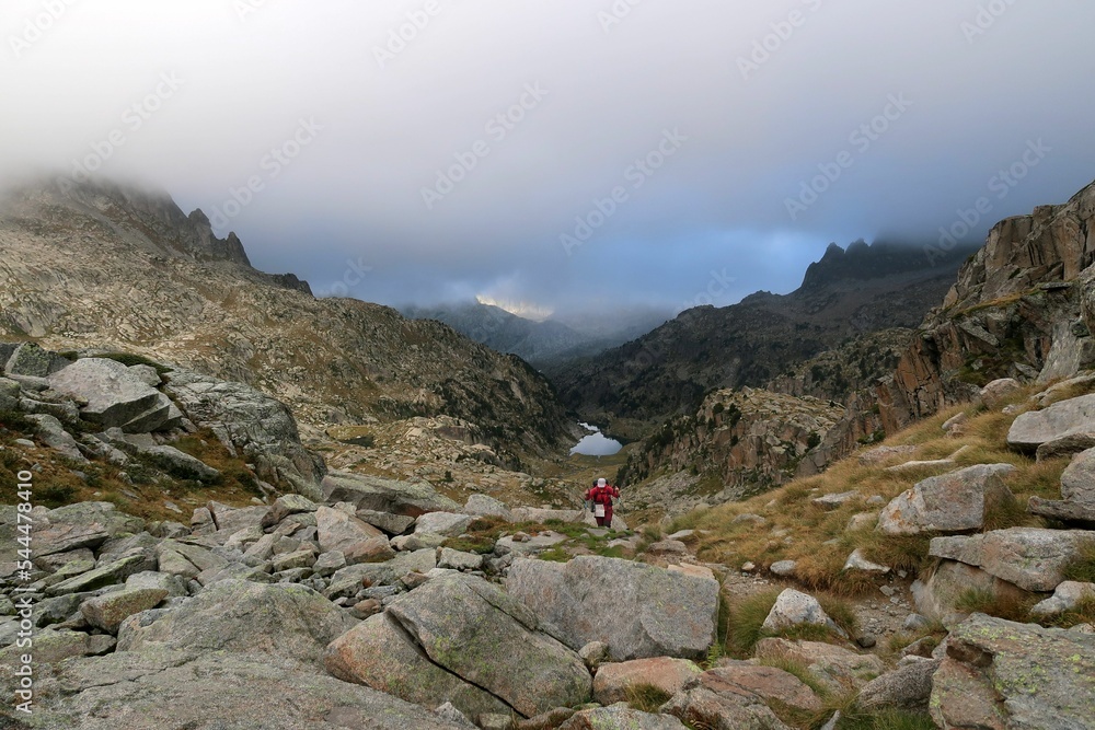 Obraz premium Pyrenees, Carros de Foc hiking tour. A week long hike from hut to hut on a natural scenery with lakes, mountains and amazing flora and fauna. 