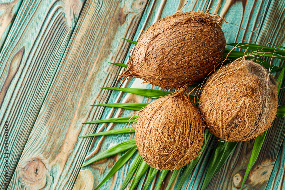 fresh natural coconut on rustik wooden background fresh natural coconut on rustik wooden background