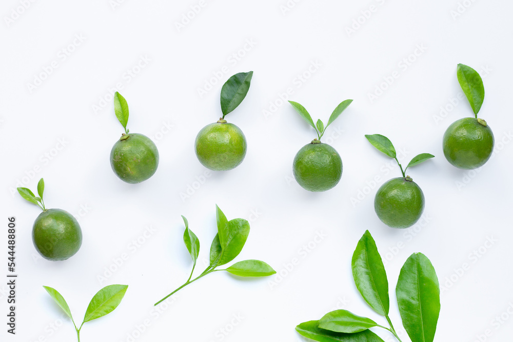 Limes with leaves isolated on white. Limes with leaves isolated on white.