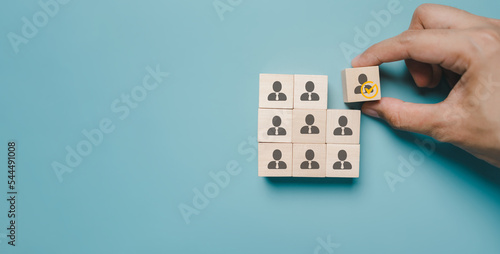 HRM or Human Resource Management, Hand selective and accept to manager icon on wood block which is among staff icons for human development recruitment leadership and customer target group concept.
