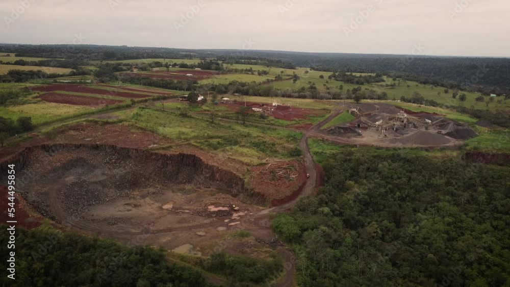 Open stone quarry, Brazil near Iguazù river mouth. Aerial orbiting Open stone quarry, Brazil near Iguazù river mouth. Aerial orbiting
