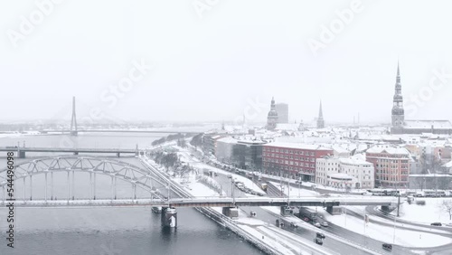 Aerial Shot Of Famous krastmala Street In Beautiful Snow On Daugava River, Latvia, Europe